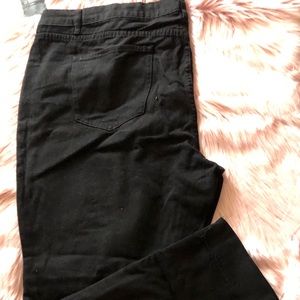 Black distressed jeans.